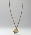 Extended chain gold sunburst pendant with 18K gold plating and recyclable components.
