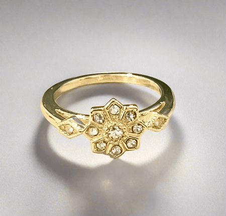 Dainty Snowflake Ring with cubic zirconia stones and gold plating.