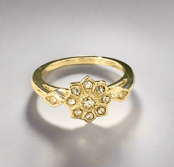 Dainty Snowflake Ring with cubic zirconia stones and gold plating.