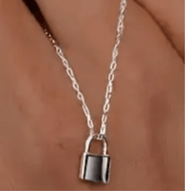 Sterling Silver Lock NecklaceOur Sterling Silver Lock Necklace is crafted with sustainability at its heart, designed for those who value style without compromising the planet. By choosing this eSterling Silver Lock NecklacePearl & PrismPearl & Prism