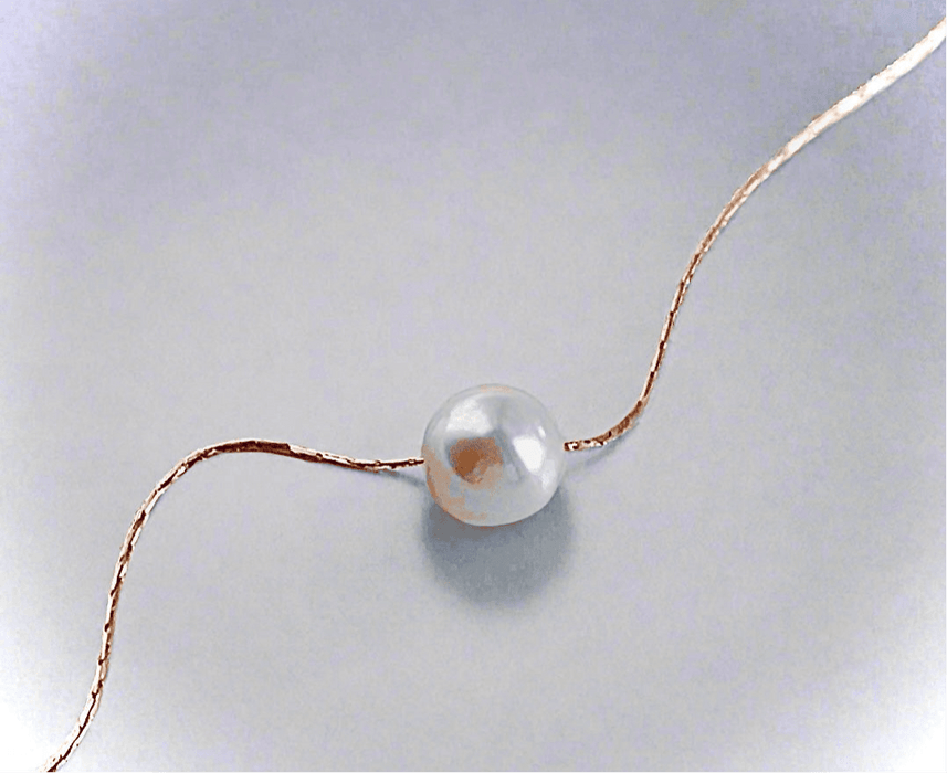 Single Pearl NecklaceOur Single Pearl Necklace embodies sustainable luxury, designed for those who value elegance without compromising the environment. Crafted with mindfulness, this pieSingle Pearl NecklacePearl & PrismPearl & Prism