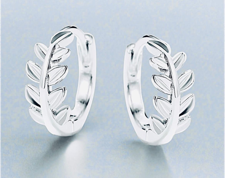 Silver Olive Branch HoopsOur Silver Olive Branch Hoops are crafted with sustainability at their heart, designed to bring timeless elegance while caring for the planet. By choosing eco-consciSilver Olive Branch HoopsPearl & PrismPearl & Prism