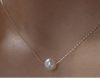 Single Pearl NecklaceOur Single Pearl Necklace embodies sustainable luxury, designed for those who value elegance without compromising the environment. Crafted with mindfulness, this pieSingle Pearl NecklacePearl & PrismPearl & Prism