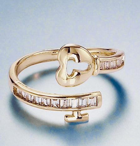 Adjustable Gold Heart Padlock RingFinding the perfect ring that fits comfortably and expresses meaningful emotions can be frustrating. Many rings either don’t fit well or lack the sentimental touch tAdjustable Gold Heart Padlock RingPearl & PrismPearl & Prism