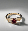Ruby Gemstone Ring with lab-grown ruby, gold plating, and cubic zirconia.