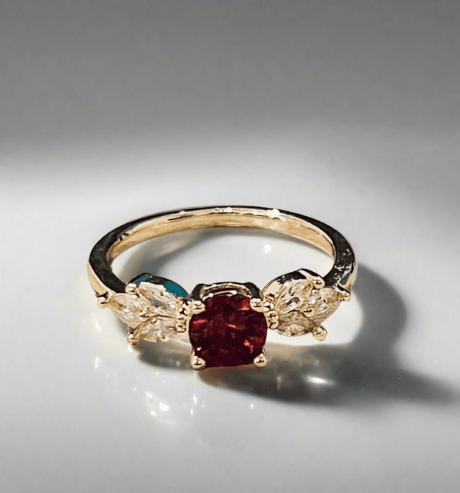 Ruby Gemstone Ring with lab-grown ruby, gold plating, and cubic zirconia.
