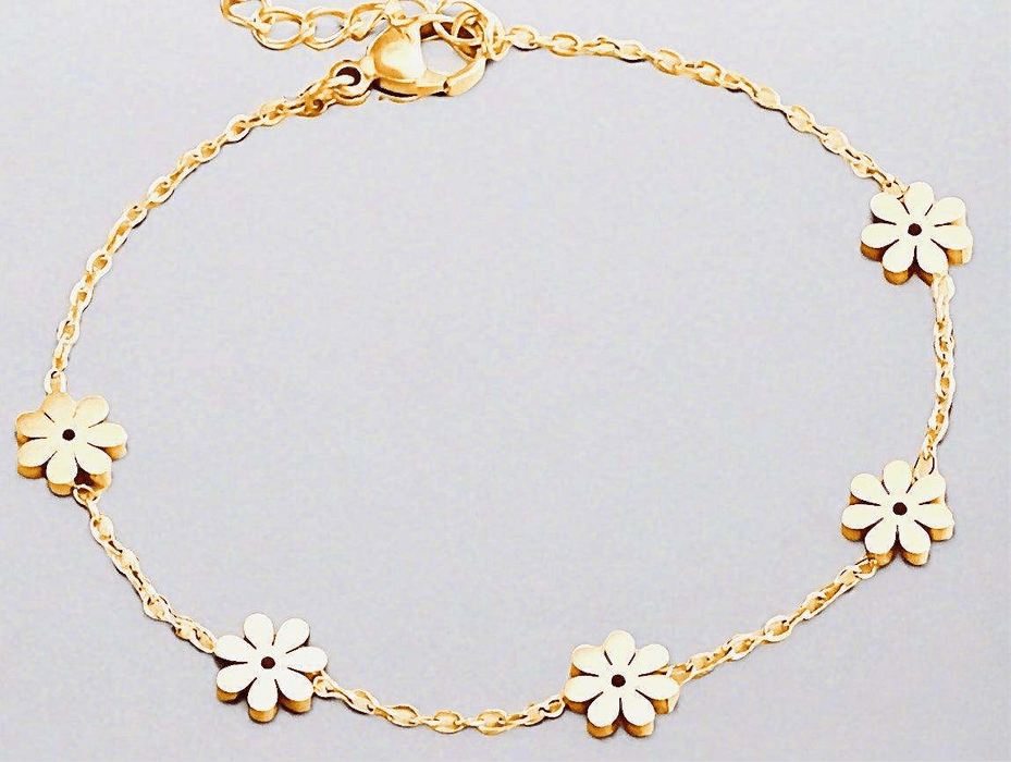 Golden Daisy Bracelet with floral motifs on a delicate gold chain, crafted from recycled gold for sustainable elegance.