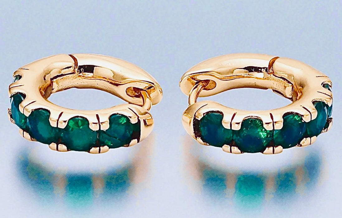 Emerald stone huggie hoops with 24K gold-filled brass and cubic zirconia accents.