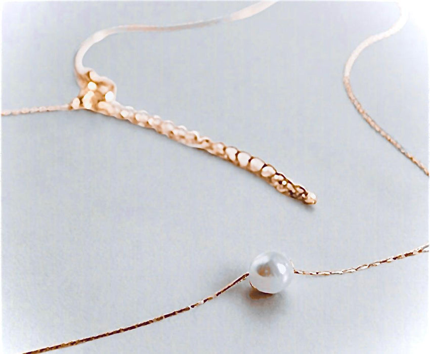 Elegant Single Pearl Necklace with gold chain highlights sustainable luxury.
