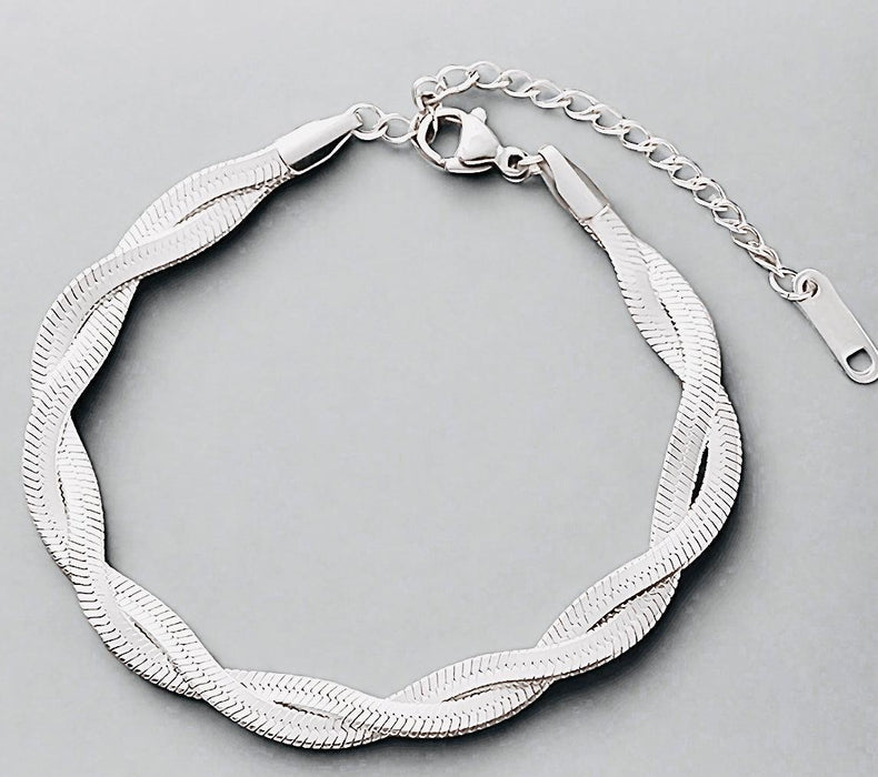 Double chain bracelet with extender, made from recycled metals for sustainable fashion.