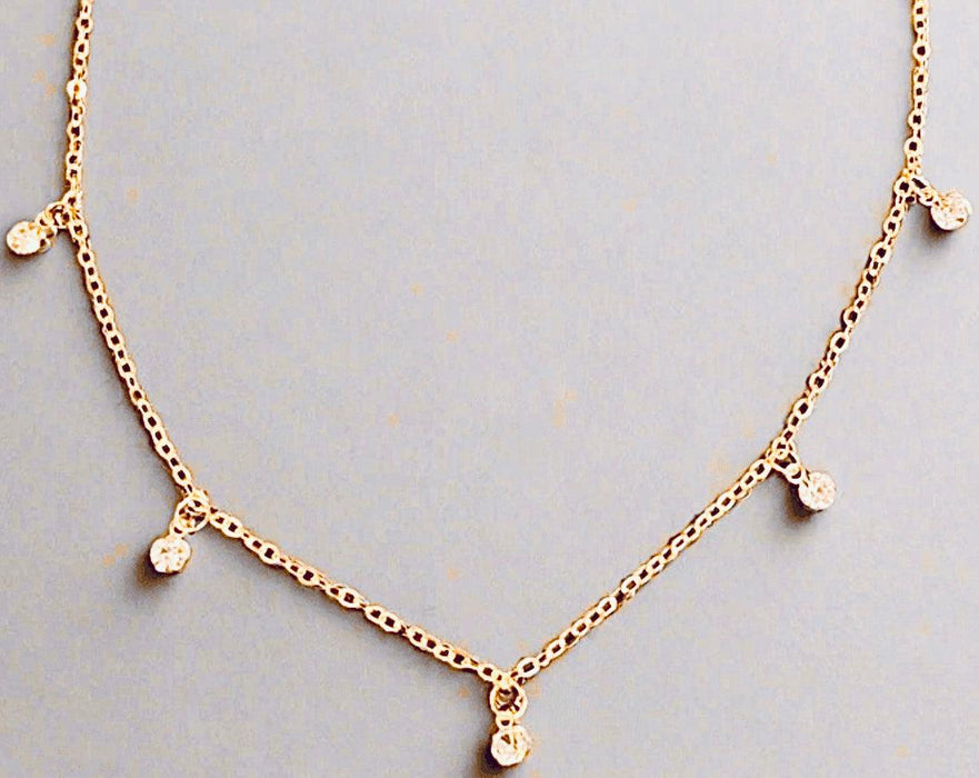 Minimalist gold beaded choker with sparkling rhinestones, eco-friendly 14K gold plating, adjustable chain.