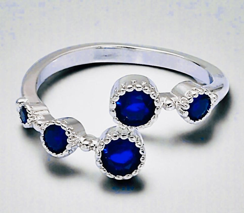 Silver Sapphire Gemstone Adjustable Ring in 925 silver with vibrant blue stones.