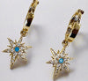Starlight hoop pendant earrings with cubic zirconia and turquoise charms, gold finish.