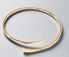 Golden Open Cuff Minimalist Bracelet made of recycled metals with eco-conscious gold plating.