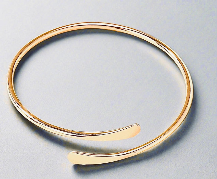 Golden Open Cuff Minimalist Bracelet made of recycled metals with eco-conscious gold plating.